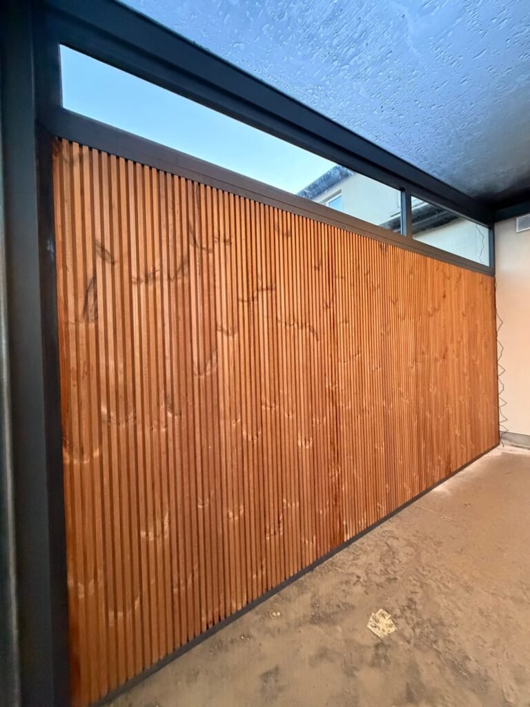Glass veranda with sliding doors attached to a house in Drogheda
